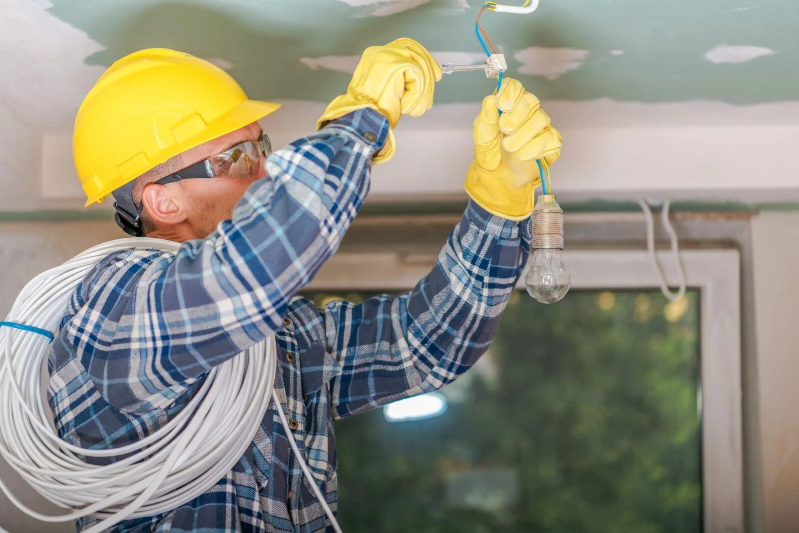 Electrician working on wiring installation