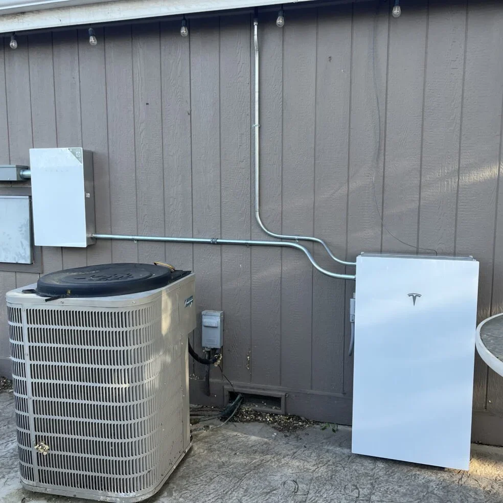 Tesla Powerwall mounted on exterior wall